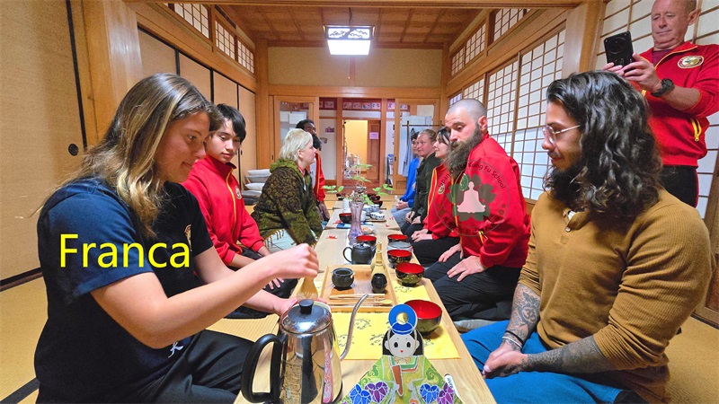International student making Japanese matcha tea in Osaka during cultural experience at Japan Osaka Kung Fu School