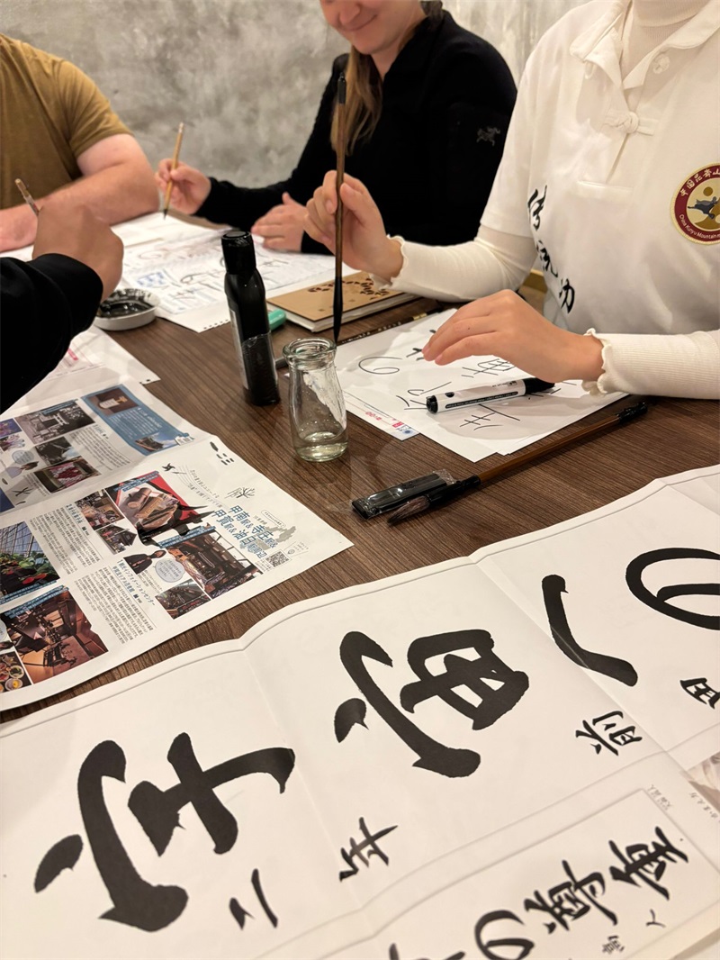 Japan Osaka Kung Fu School students learning traditional calligraphy and cultural knowledge