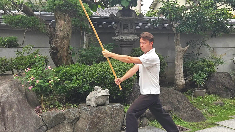  Japan Kung Fu reviews - Alexsander practicing Shaolin staff at Japan Osaka Kung Fu School.